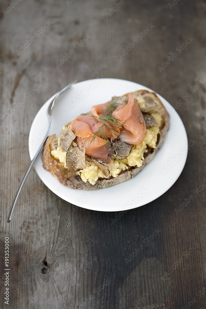 Salmon sandwich with scrambled eggs and truffle