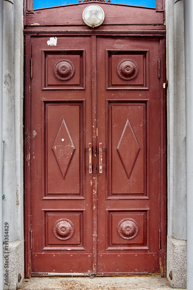 Brown wooden door. Closeup of old brown wooden house entrance door Brown wooden door. Closeup of old brown wooden house entrance door