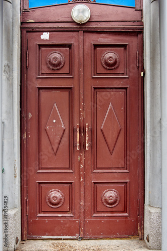 Brown wooden door. Closeup of old brown wooden house entrance door