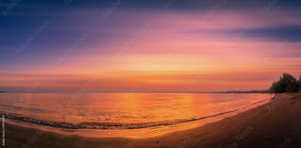Landscapes of sunset on the beach with colorful sky background.