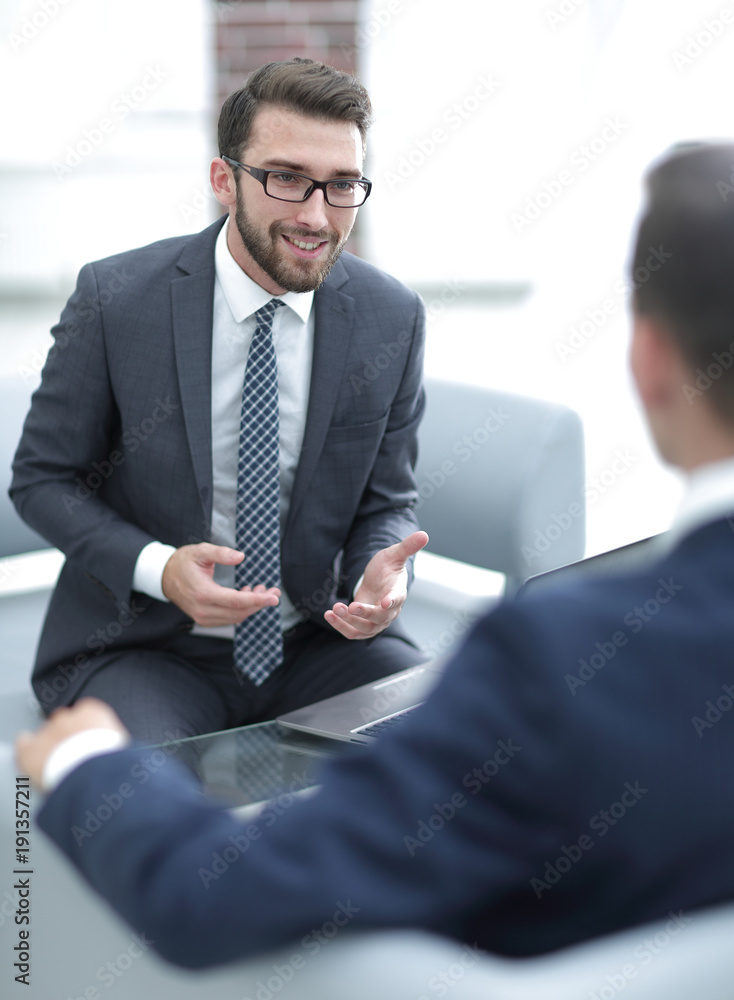Portrait of a group of business men working together at a meetin Portrait of a group of business men working together at a meetin