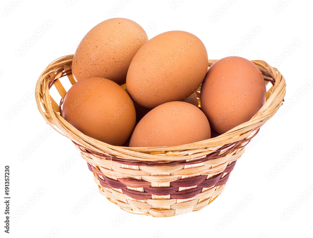 Preparation for Easter. Chicken eggs in wicker basket Preparation for Easter. Chicken eggs in wicker basket