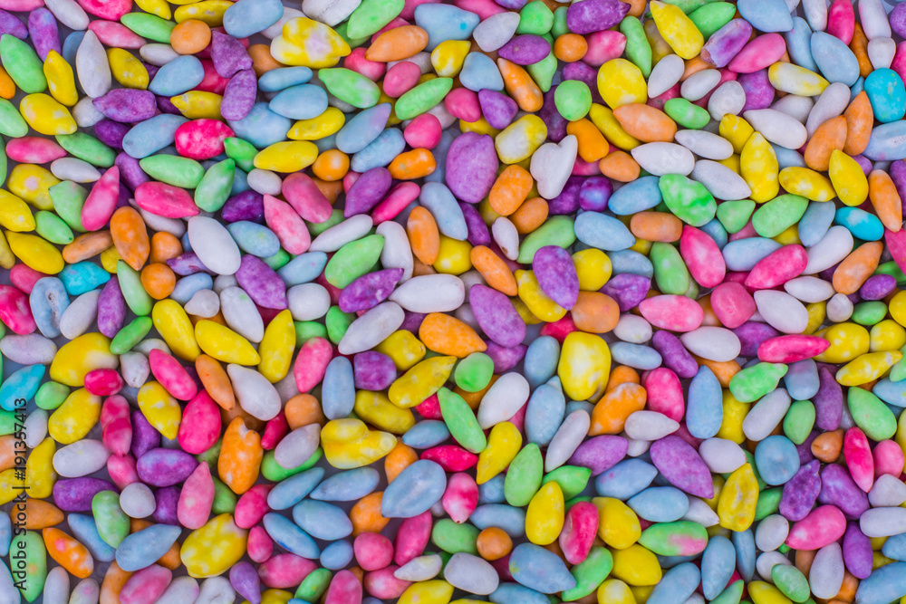 Background, texture of multi-colored small sweet dragees Background, texture of multi-colored small sweet dragees