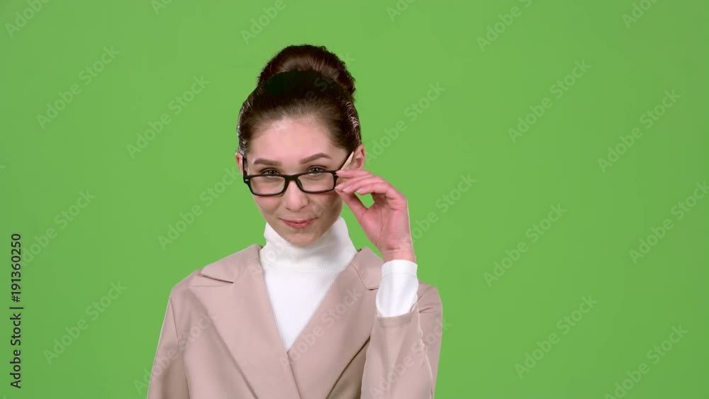 Businesswoman flirts and builds eyes to the guys. Green screen. Slow motion Businesswoman flirts and builds eyes to the guys. Green screen. Slow motion