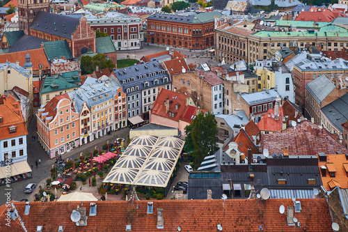 Top view on the old town with beautiful colorful buildings and a market place in Riga city, Latvia