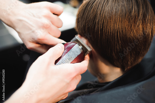 cute young boy getting a haircut