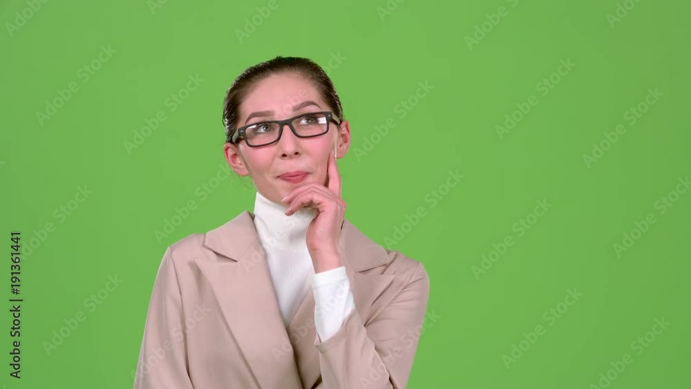 Girl reflects on the working moments. Green screen. Slow motion Girl reflects on the working moments. Green screen. Slow motion