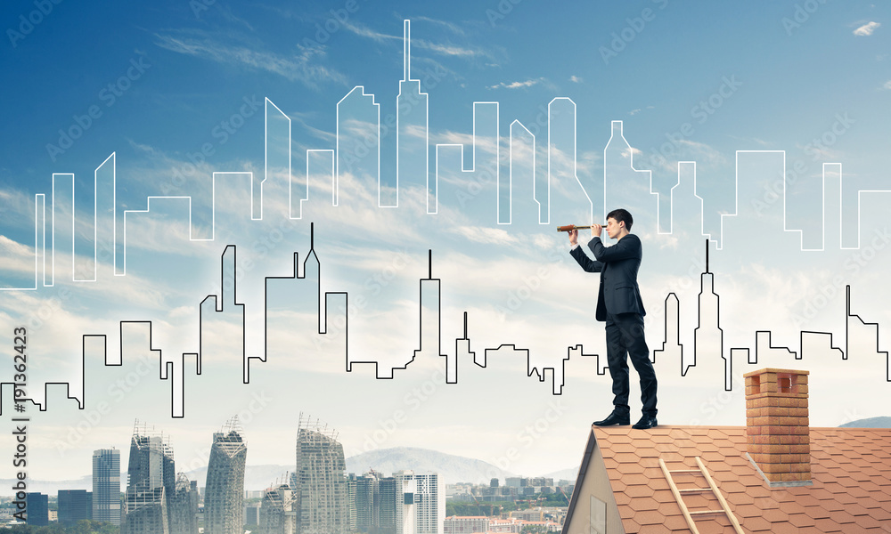 Engineer man standing on roof and looking in spyglass. Mixed med Engineer man standing on roof and looking in spyglass. Mixed med