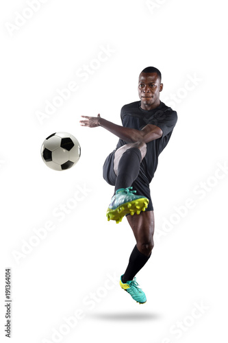 Fototapeta Naklejka Na Ścianę i Meble -  African American Soccer Player Kicking Ball