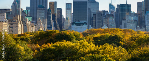Panoramic view of Midtown skyscrapers and Central Park tree tops in Fall. Central Park South, Manhattan, New York City