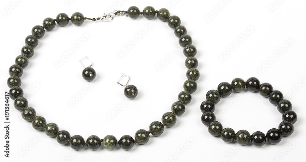 Necklace with stones on a white background. Bijouterie. Women's accessories. Necklace on the neck. Valuable jewelry.Decorating for women.Women's accessories isolated white background Necklace with stones on a white background. Bijouterie. Women's accessories. Necklace on the neck. Valuable jewelry.Decorating for women.Women's accessories isolated white background