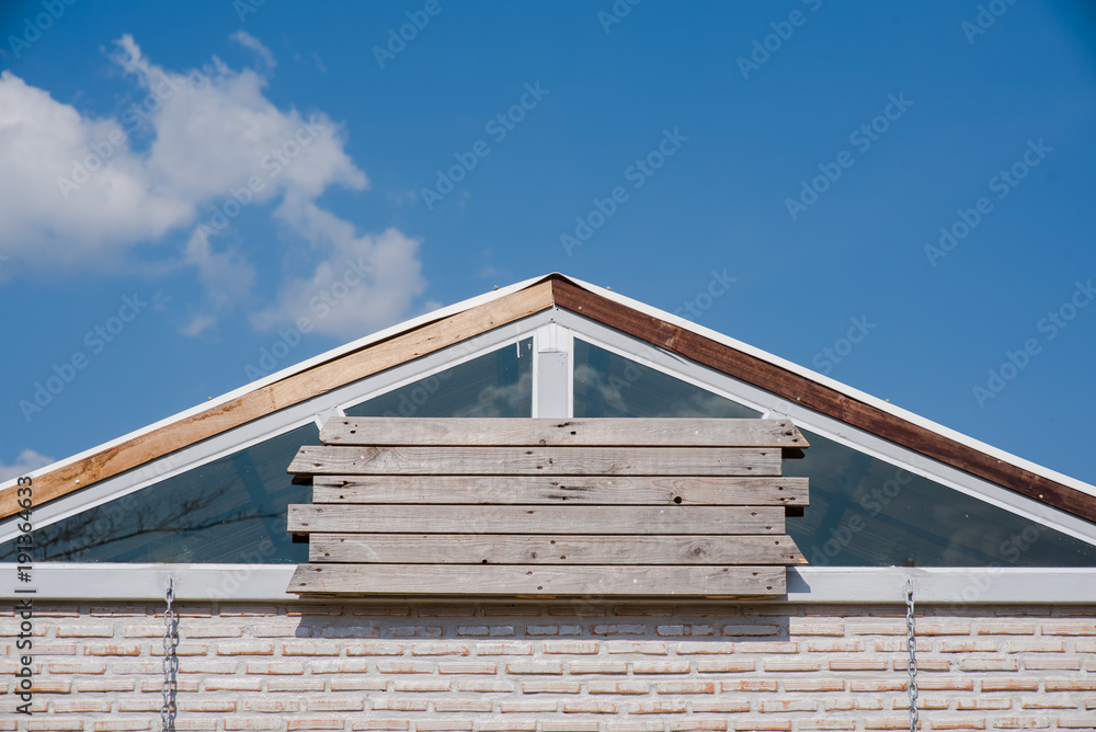 empty wooden vintage frame on beautiful roof with blue sky