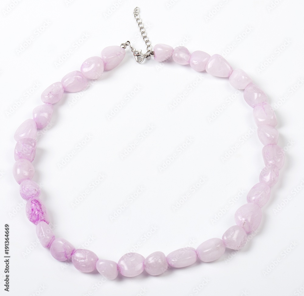 Obraz premium Necklace with stones on a white background. Bijouterie. Women's accessories. Necklace on the neck. Valuable jewelry.Decorating for women.Women's accessories isolated white background