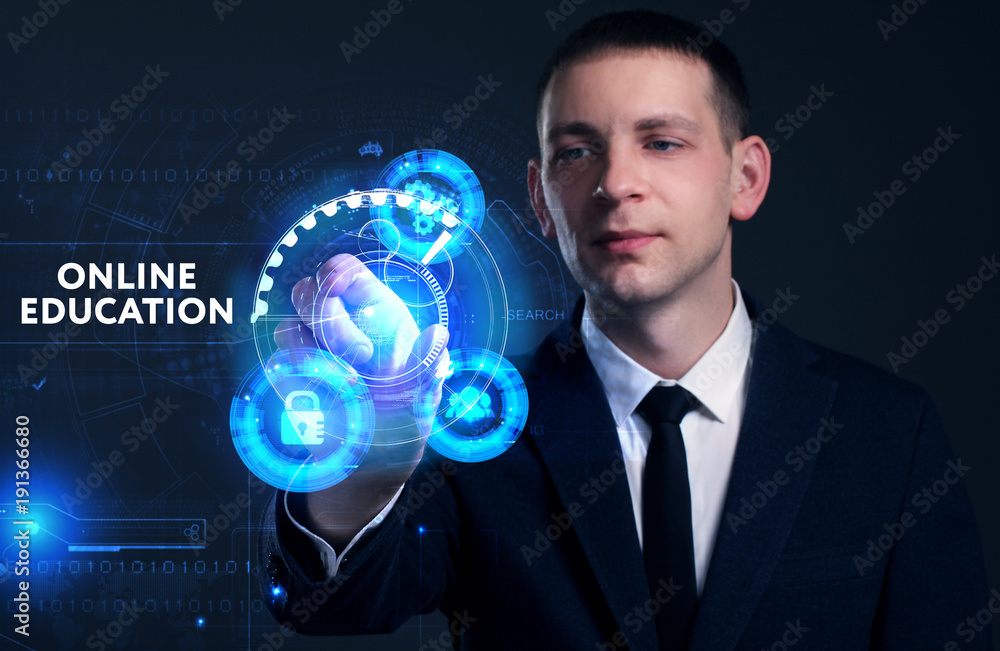 Business, Technology, Internet and network concept. Young businessman working on a virtual screen of the future and sees the inscription: Online education Business, Technology, Internet and network concept. Young businessman working on a virtual screen of the future and sees the inscription: Online education