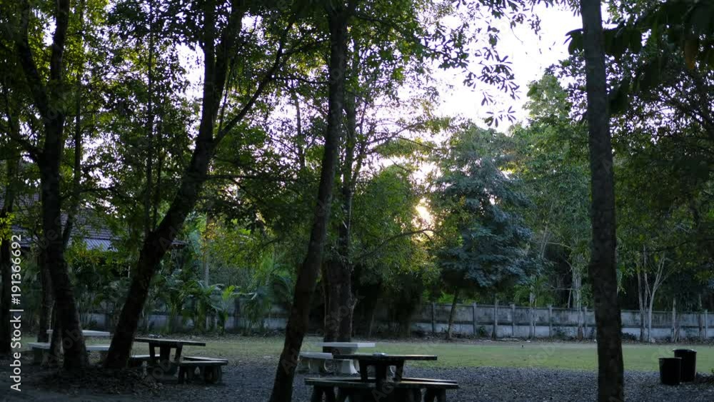table & chair in garden. Time lapse of sunset in park. Summer landscape. table & chair in garden. Time lapse of sunset in park. Summer landscape.