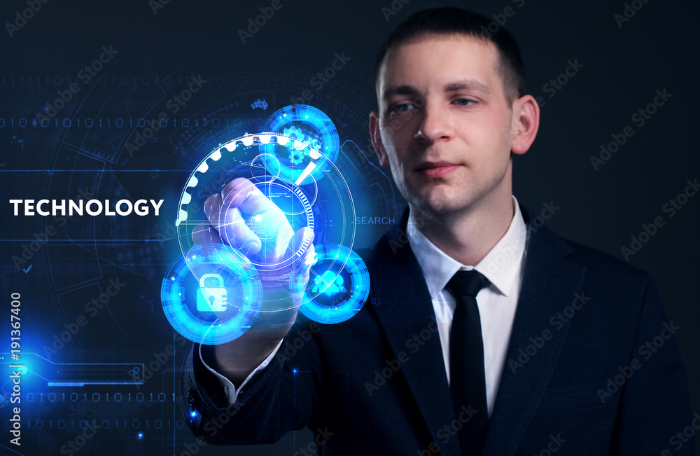 Business, Technology, Internet and network concept. Young businessman working on a virtual screen of the future and sees the inscription: Technology Business, Technology, Internet and network concept. Young businessman working on a virtual screen of the future and sees the inscription: Technology
