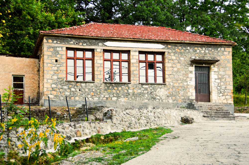 The old made of stone School in Zarouhla village, located in Achaia, Greece