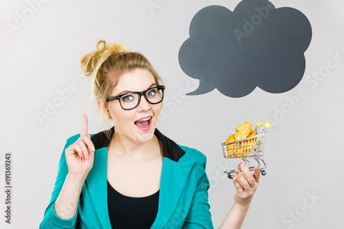 Bussines woman holding shopping cart with sweet bun