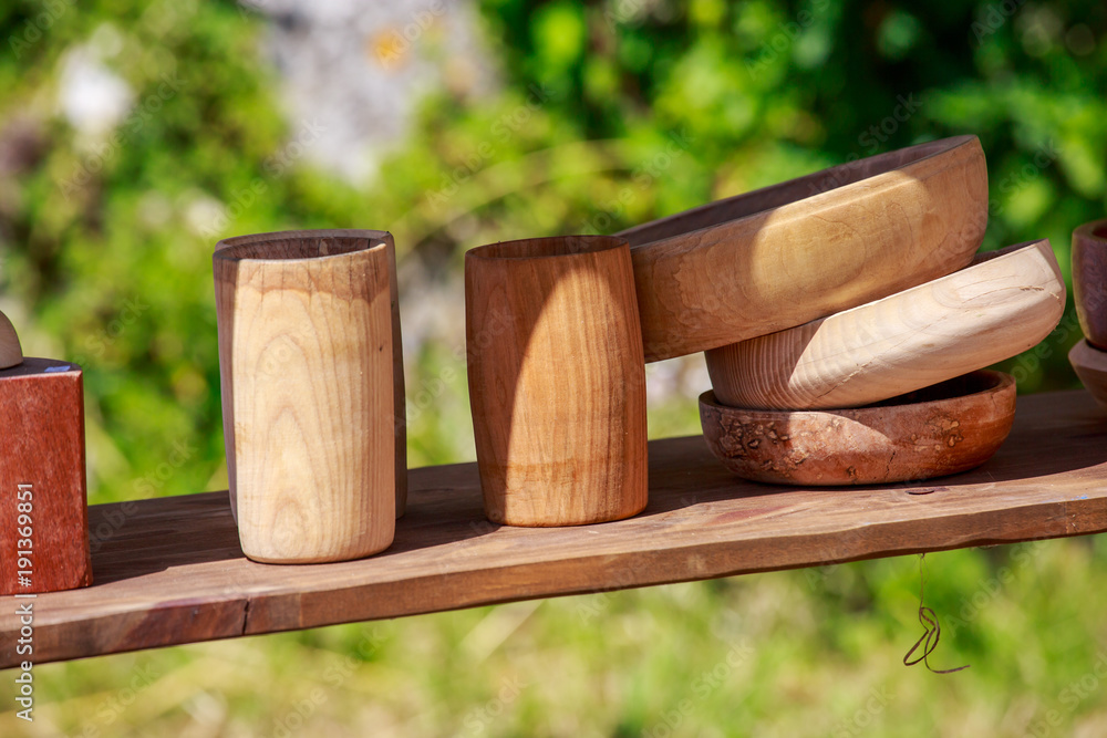Wooden utensitls on wooden stand under sunny day Wooden utensitls on wooden stand under sunny day