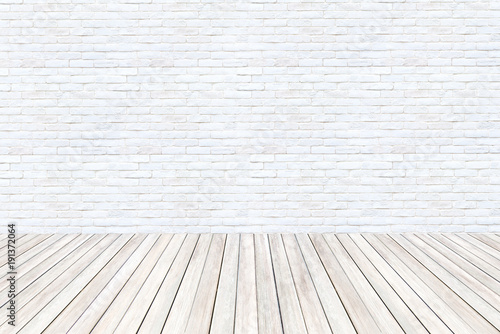 interior room with white cement brick wall and wooden floor