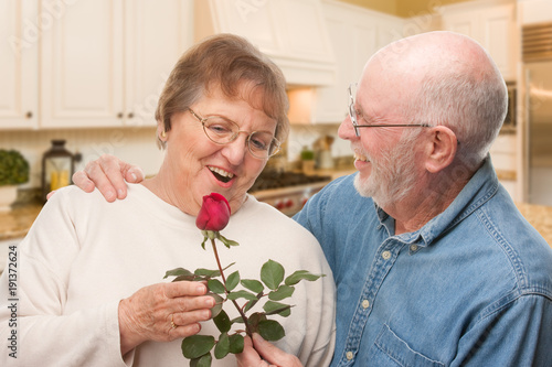 Happy Senior Adult Man Givi...