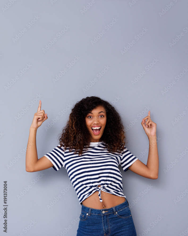 cool young black woman pointing up cool young black woman pointing up