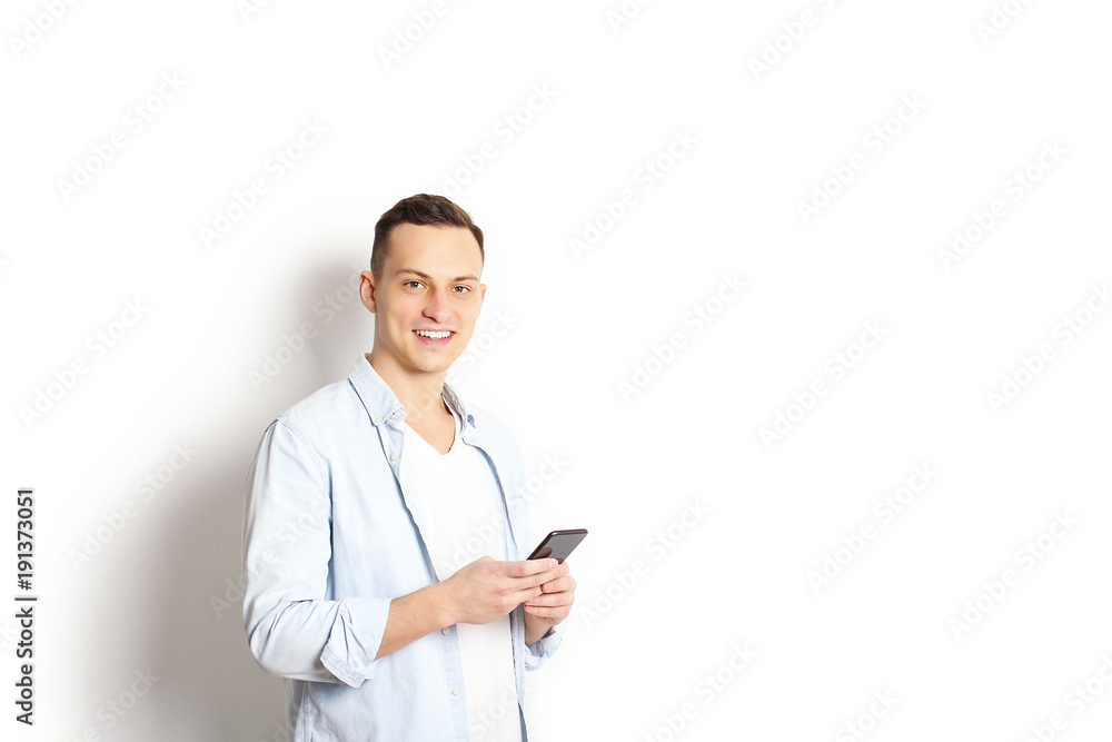 Young man checking mobile phone, reading a message. Technology & relationship concept. Modern romance troubles. Male & female online dating app. Touch screen, chatting, swiping, browsing, surfing. Young man checking mobile phone, reading a message. Technology & relationship concept. Modern romance troubles. Male & female online dating app. Touch screen, chatting, swiping, browsing, surfing.