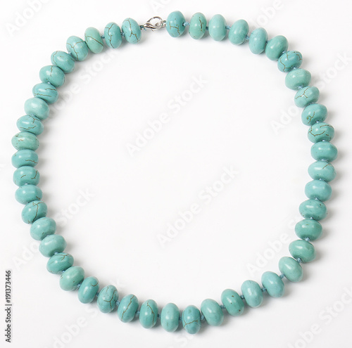 Necklace with stones on a white background. Bijouterie. Women's accessories. Necklace on the neck. Valuable jewelry.Decorating for women.Women's accessories isolated white background