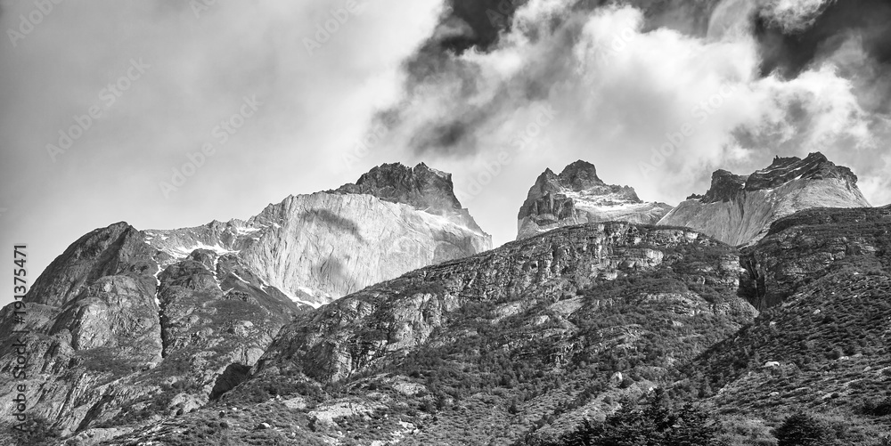 Black and white panoramic picture of the Cuernos del Paine rock formations in the Torres del Paine National Park, Chile.