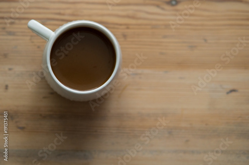 small white cup of coffee