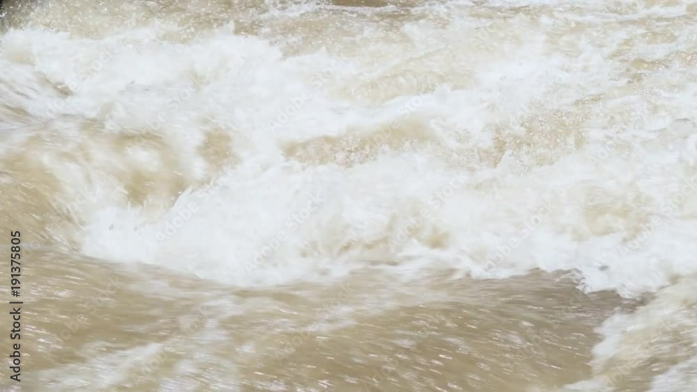 Water flowing through waterfall. Slow motion shot. White water in thailand. Water flowing through waterfall. Slow motion shot. White water in thailand.