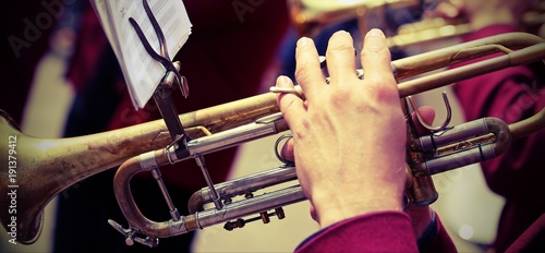 trumpeter plays his trumpet in the brass band with vintage effect