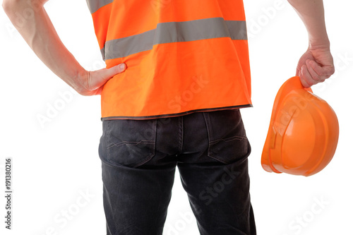 builder worker holding orange protectiive cask isolated on white photo