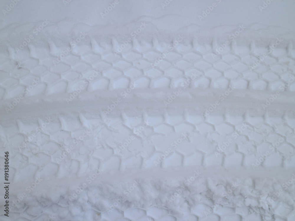 car footprints in the snow car footprints in the snow
