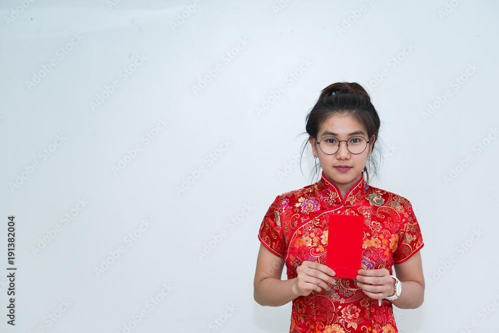 Portrait of beautiful asian woman in Cheongsam dress,Thailand people,Happy Chinese new year concept Portrait of beautiful asian woman in Cheongsam dress,Thailand people,Happy Chinese new year concept