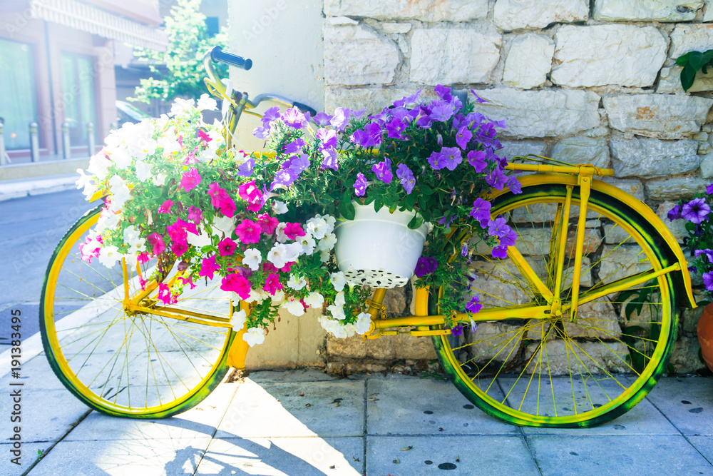 charming street decoration - old bike with flowers