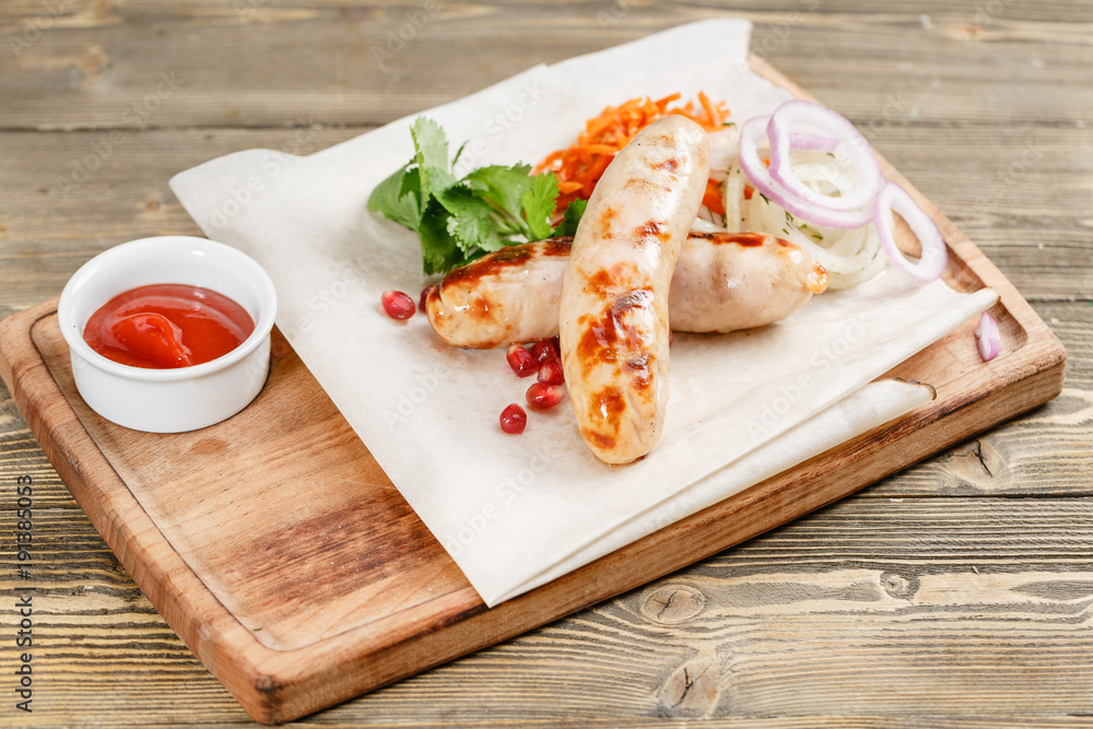 grilled sausages. Serving on a wooden Board on a rustic table. Barbecue restaurant menu, a series of photos of different meats grilled sausages. Serving on a wooden Board on a rustic table. Barbecue restaurant menu, a series of photos of different meats