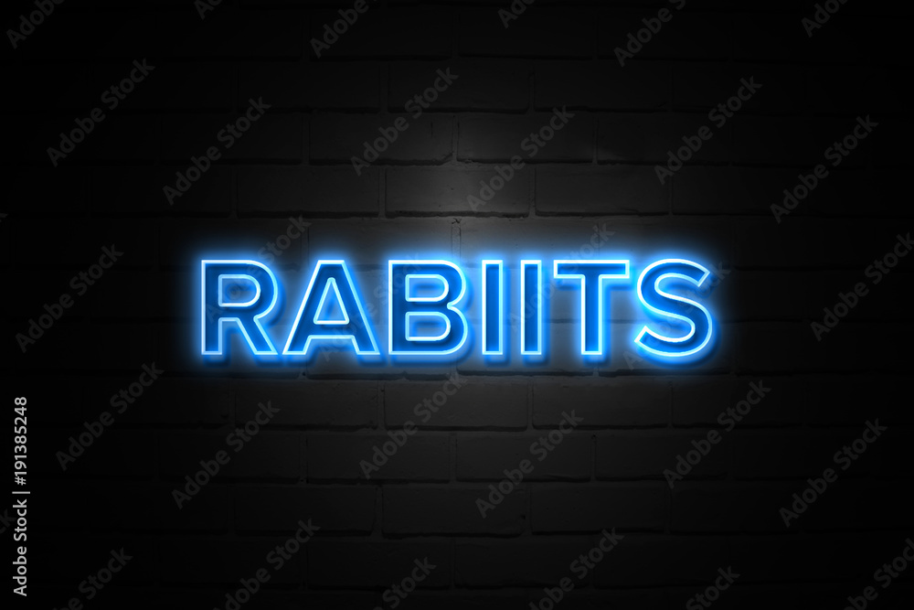 Rabiits neon Sign on brickwall
