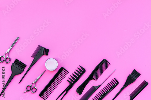 Beauty saloon equipment. Hairdress, haircut. Combs, sciccors, brushes on pink background top view copy space