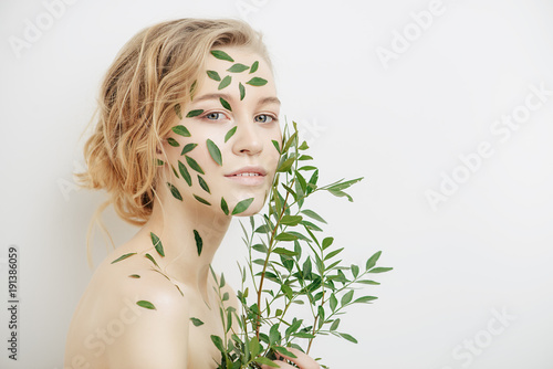 green leaves on face