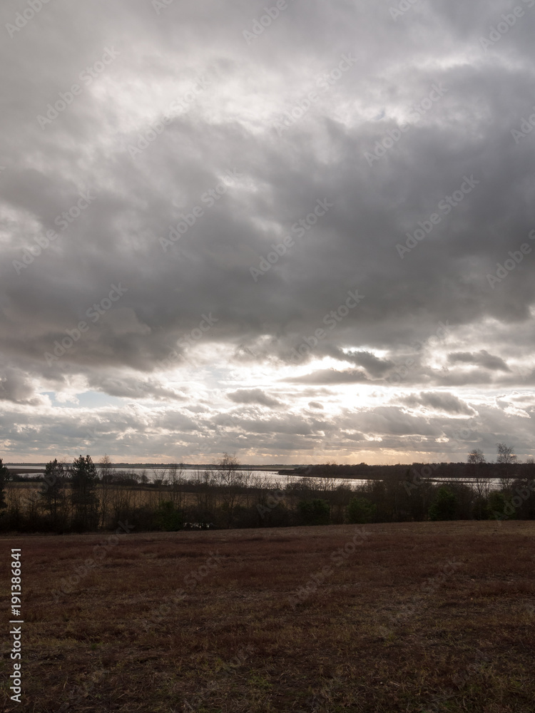 moody skyline clouds over autumn farm field moody skyline clouds over autumn farm field