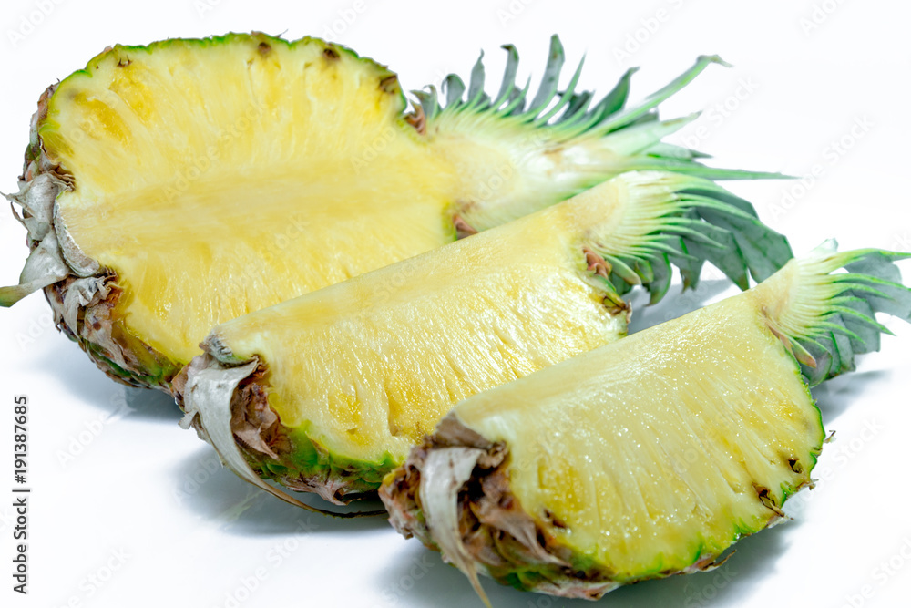 Pineapple half. Pineapple slice isolated on white. Pineapple with leaves. Full depth of field Pineapple half. Pineapple slice isolated on white. Pineapple with leaves. Full depth of field