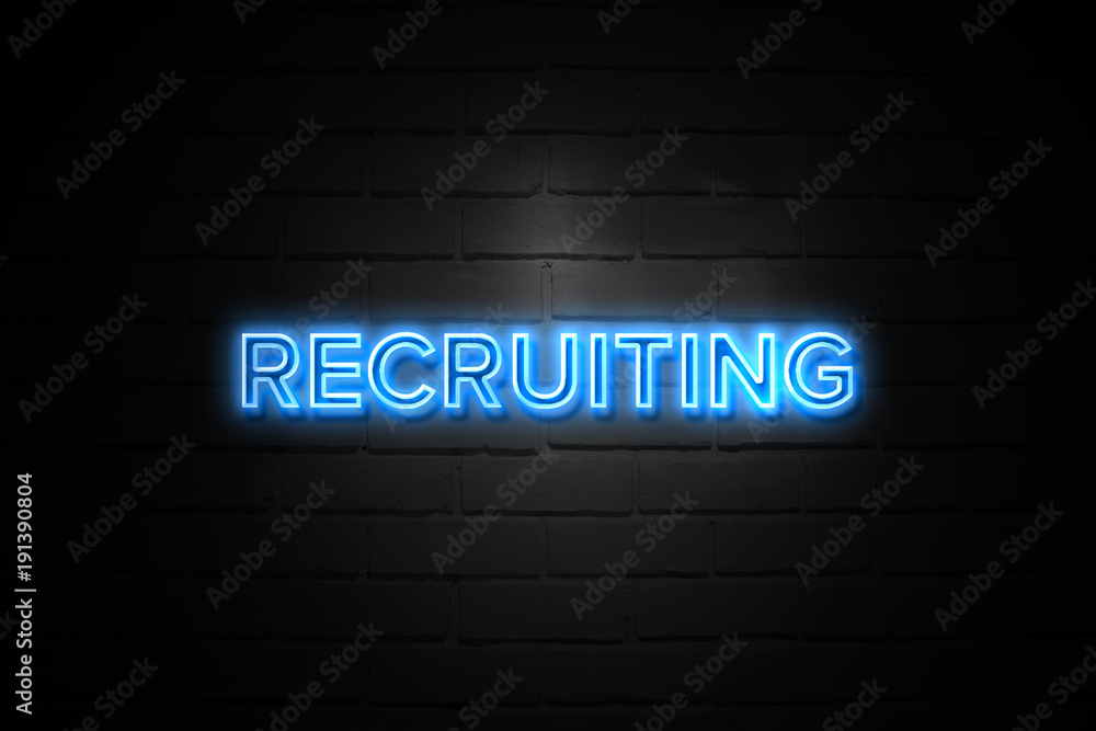 Recruiting neon Sign on brickwall