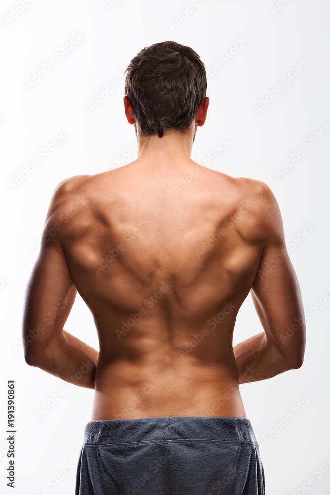 Fototapeta premium Naked male torso seen from behind