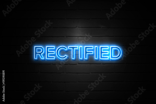 Rectified neon Sign on brickwall