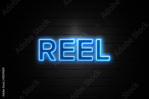 Reel neon Sign on brickwall