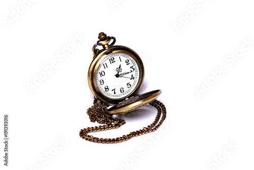 Pocket watch in yellow case on a white background