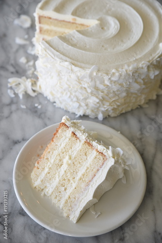 Slice of layered cake on white plate