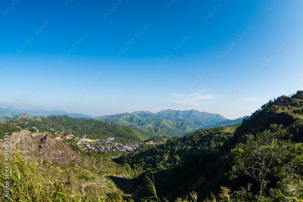 Mountain and small village and blue sky.