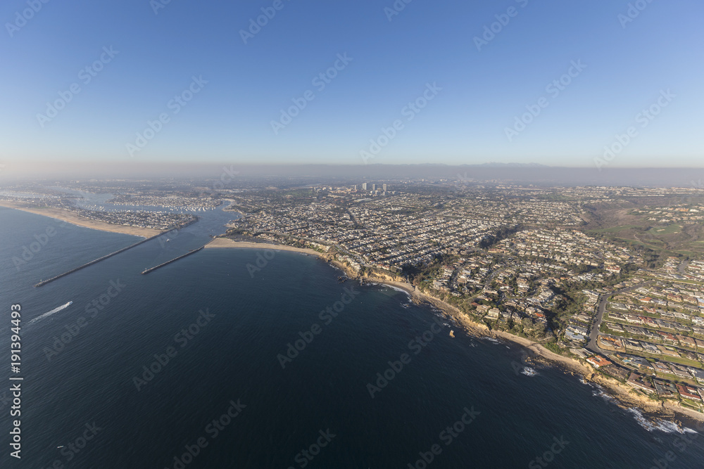 Aerial view of of Corona del Mar, Newport Beach and the entrance to Balboa Bay on the scenic Orange County California coast.  